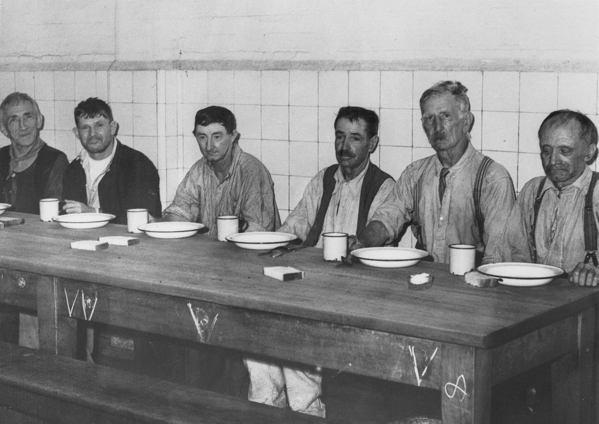 Waiting for their meal at the Dunwich Benevolent Asylum, North Stradbroke Island, 1938