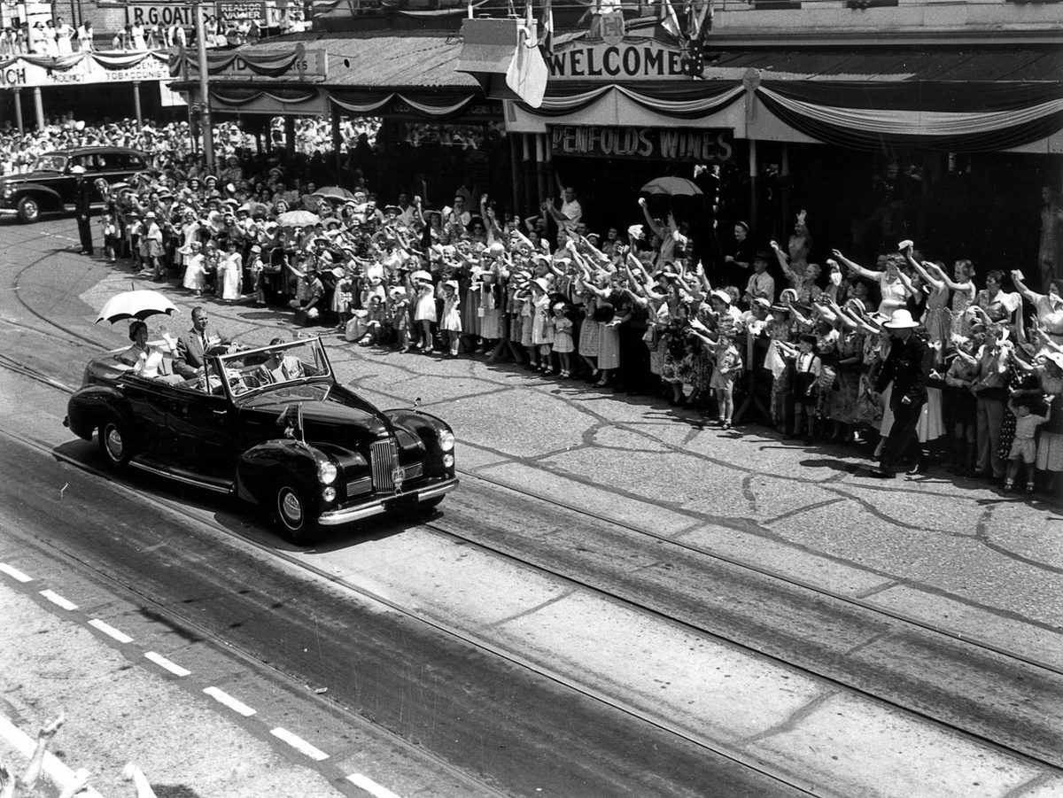 Waving to the royal visitors from Queen Street, Brisbane, 1954, Brisbane City