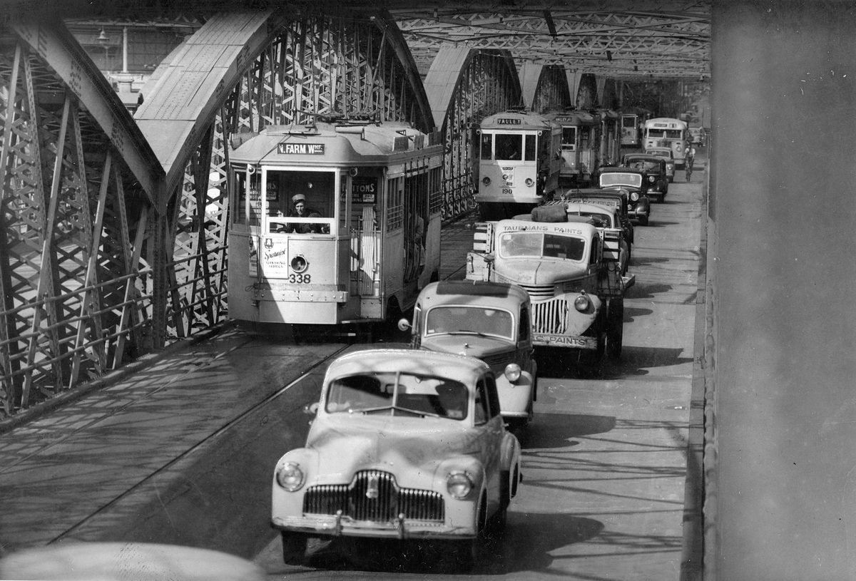 Cars and trams travelling along Victoria Bridge, Brisbane, 1952, Brisbane City