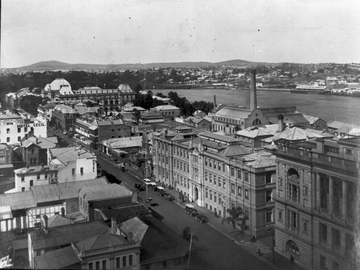 George Street looking past the Government Printing Office towards Parliament House with a view of the Brisbane River in the background, Brisbane City (1926)