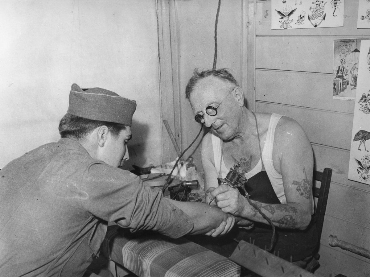 Young American soldier gets his first tattoo, Brisbane, 1943
