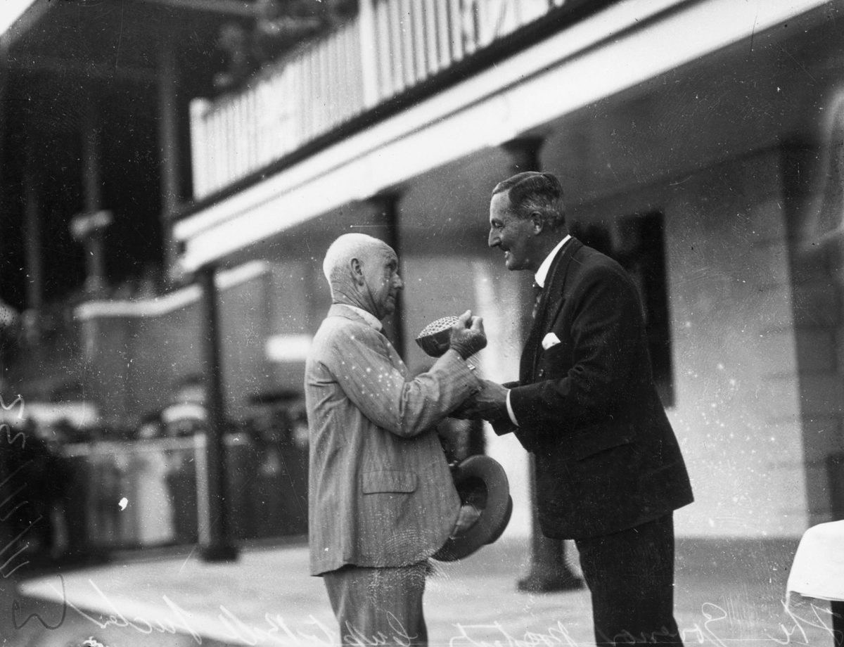 Queensland Cup being presented to racehorse owner Bill Tucker, Ascot, Brisbane, 1933