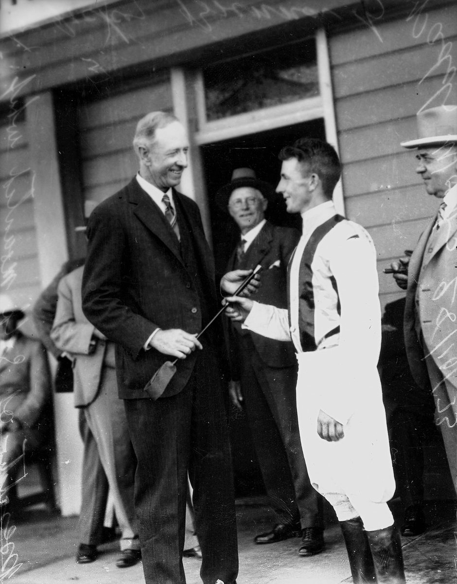 Tommy Brennan being presented with the Fourex whip at Albion Park races, Brisbane, October 1933