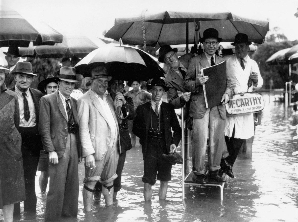 Marooned in the bookmaker's ring at Albion Park after a storm, Brisbane, January 1941