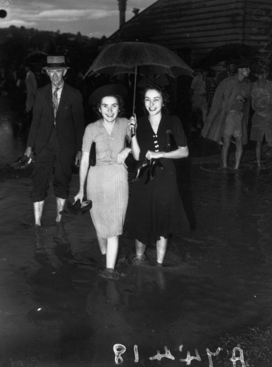 Two young punters wading in the water at Albion Park, Brisbane, 1941