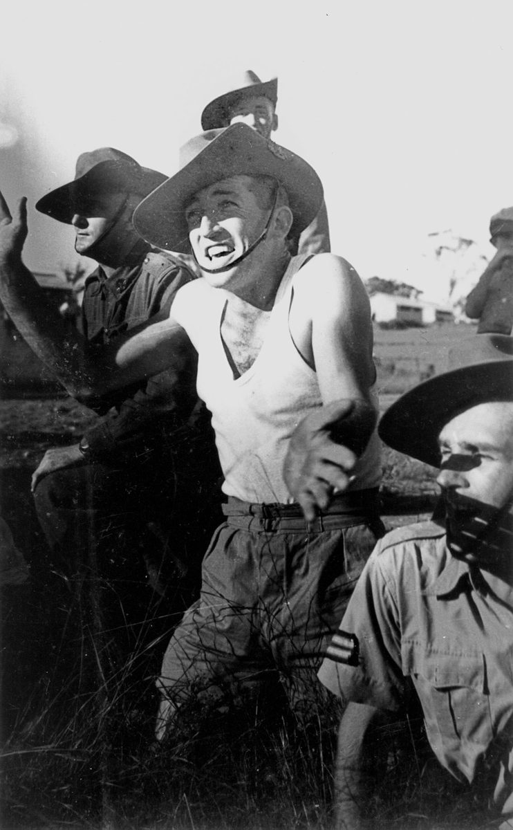 Soldiers watching the action at a sports meeting, Brisbane, March 1940