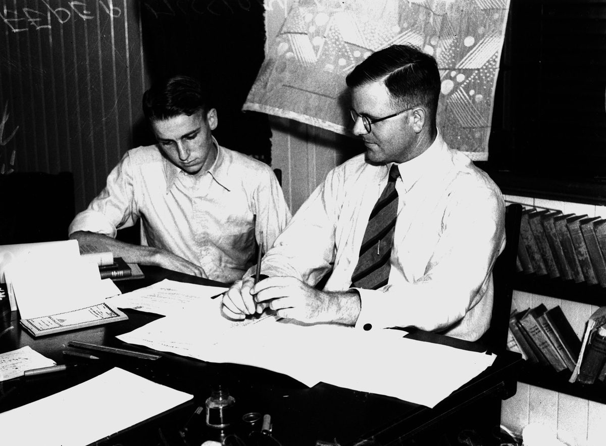 Dr. Graham Croll and R.A. Hartley discussing details of their epic health survey trip into the Far North, 1939, Brisbane