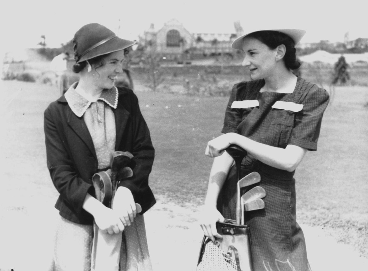 Eileen Murphy and friend posing with their golf clubs, Brisbane, 1939