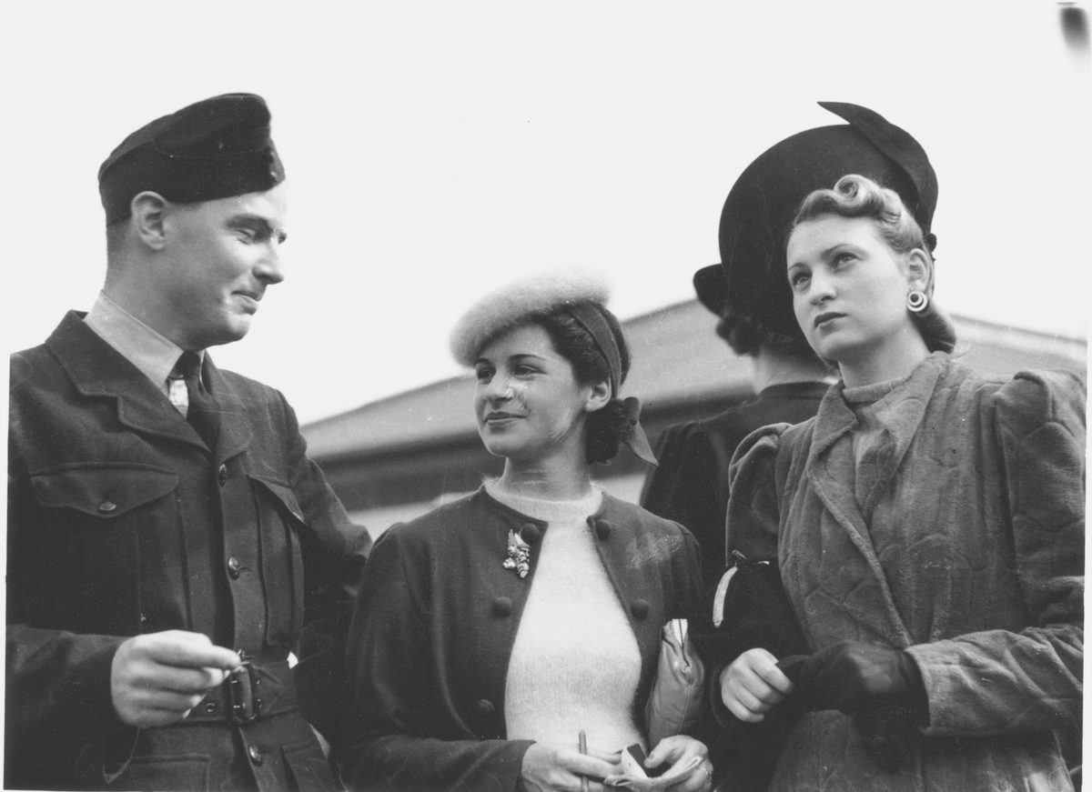 Mr. D. W. H. Kenyon, Joan Charters and June Shepherd at the Doomben Races, Brisbane, 1940
