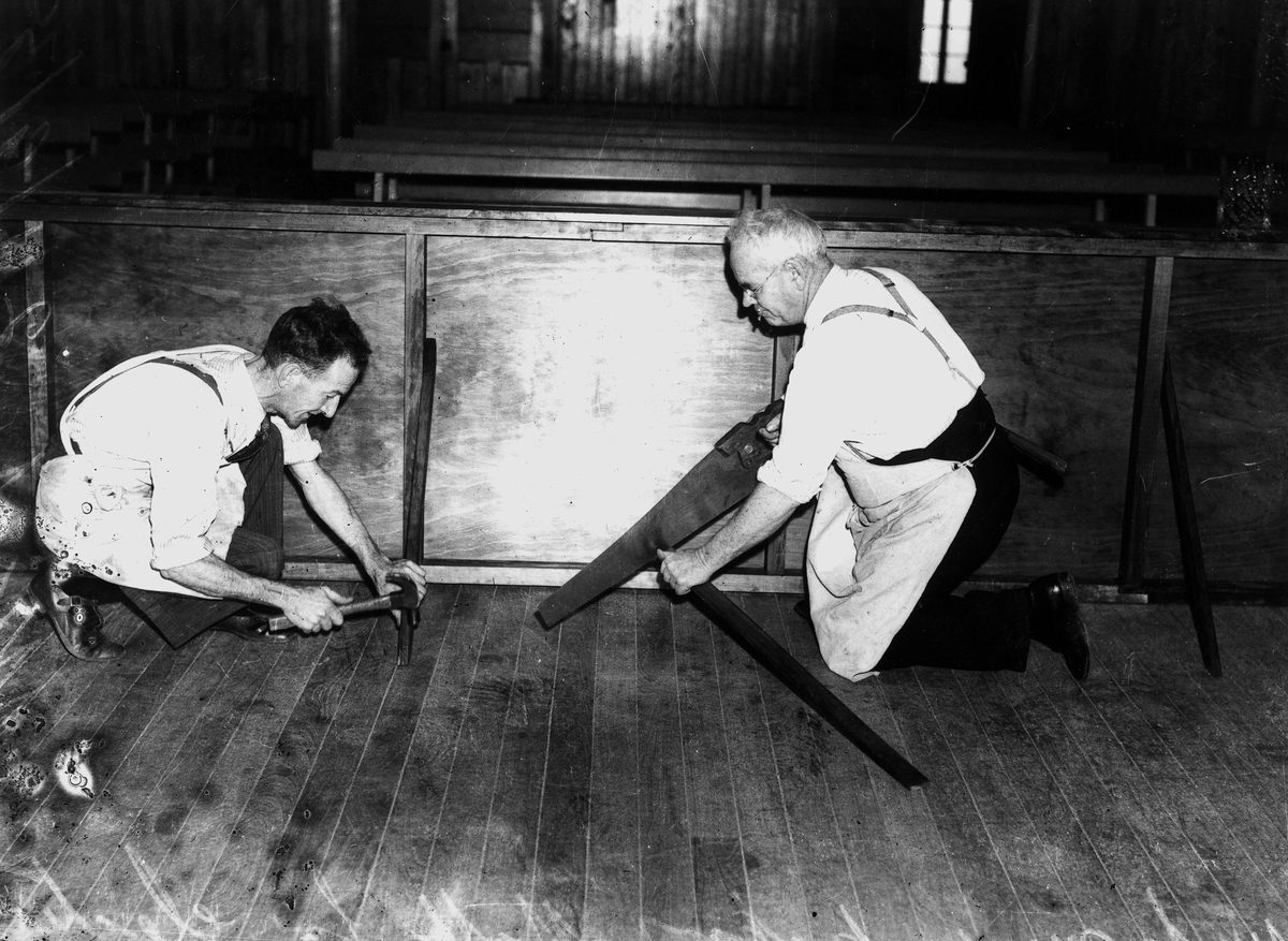 Workmen preparing the Rosalie School of Arts for an election tribunal, 1938