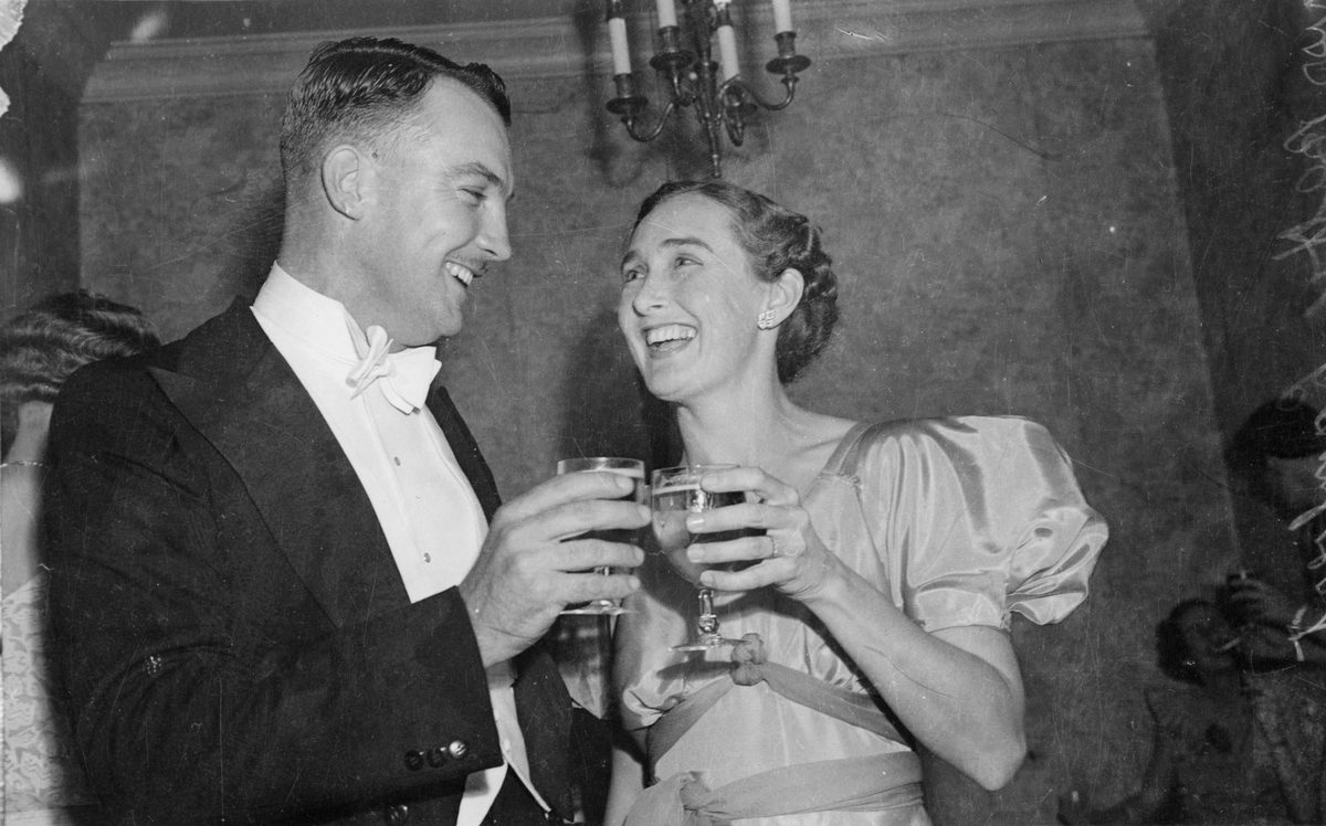 Young couple celebrating at the Bellevue Hotel, Brisbane, 1940