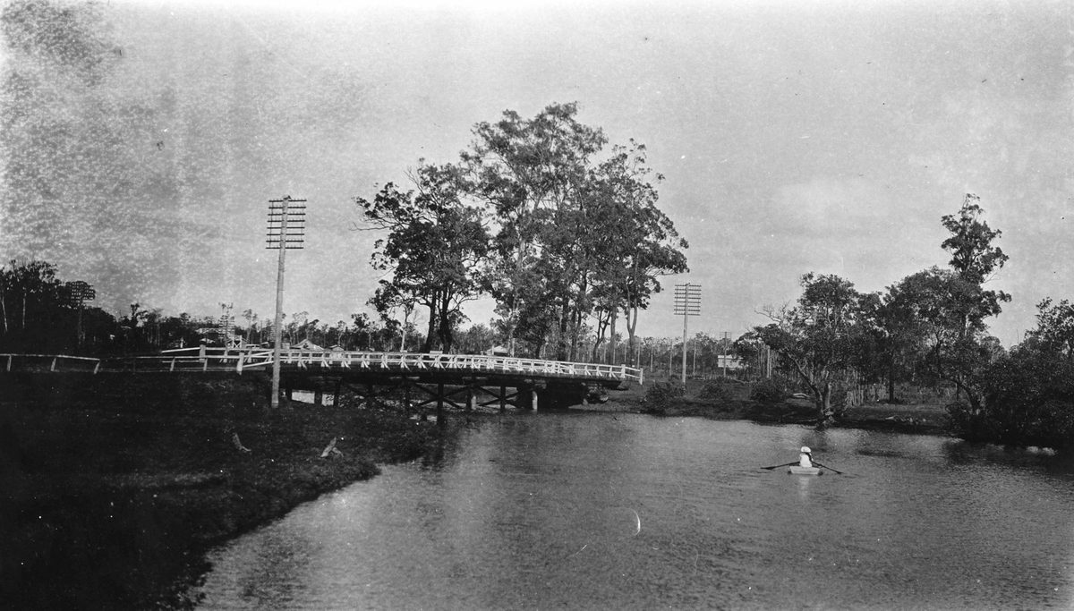 Lone rower on Cabbage Tree Creek, Boondall, Brisbane, 1921