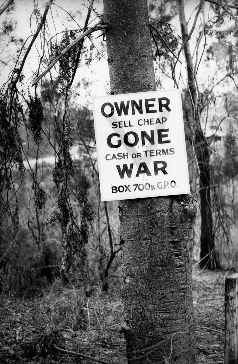 Sign nailed to a tree on a property in Toowong, Brisbane, October 1941