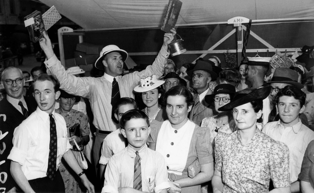 Watching the chocolate wheel at many of the Liberty Week stalls in Queen Street, Brisbane, 1941, Brisbane City
