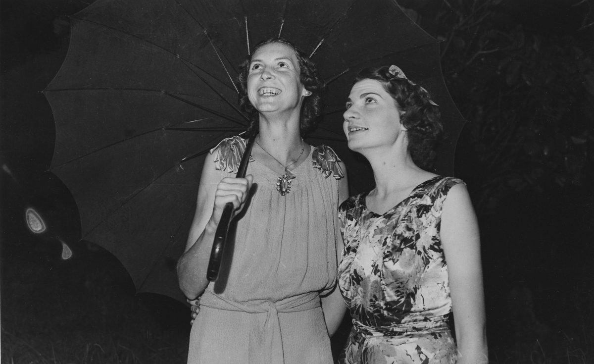 Two women take shelter when they arrived at All Saints Dance Hall, 1940, Brisbane