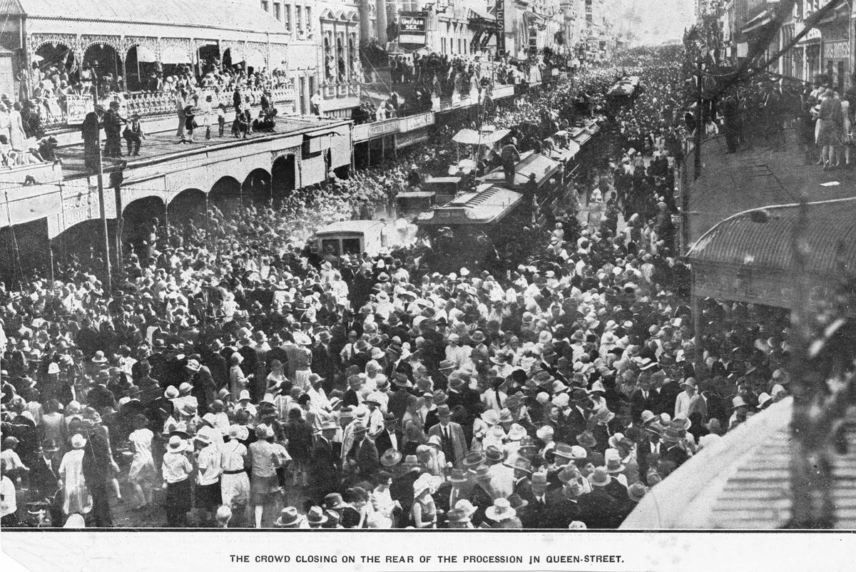 Crowd closing on the rear of the procession in Queen Street to welcome Queensland Aviator Bert Hinkler, Brisbane, 1928, Brisbane City