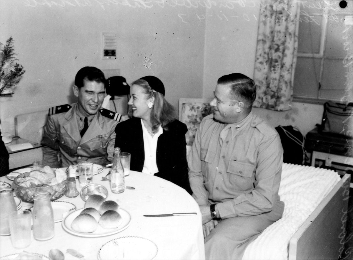 Phyllis Brooks at lunch with servicemen, Lennon's Hotel, Brisbane, 1943