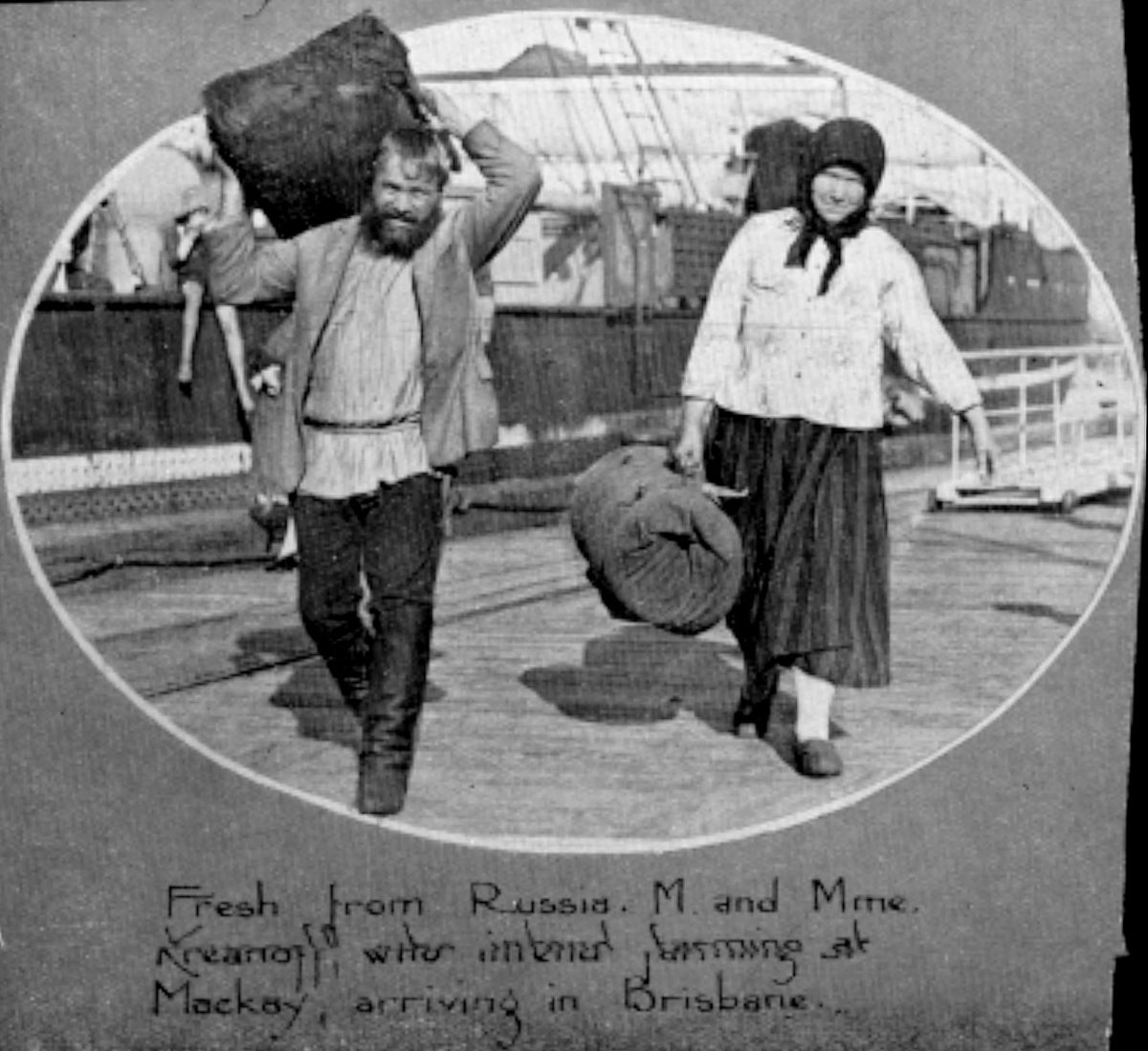 Two Russian immigrants disembarking from a ship at Brisbane in 1931