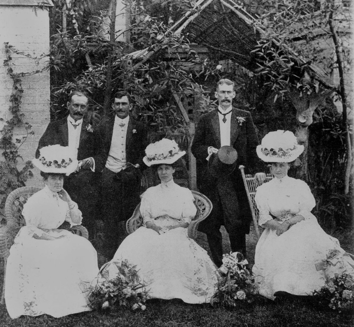 Attendants from the Persse - Parry-Okeden wedding in the gardens of Delamore, Kedron, Brisbane, 1907