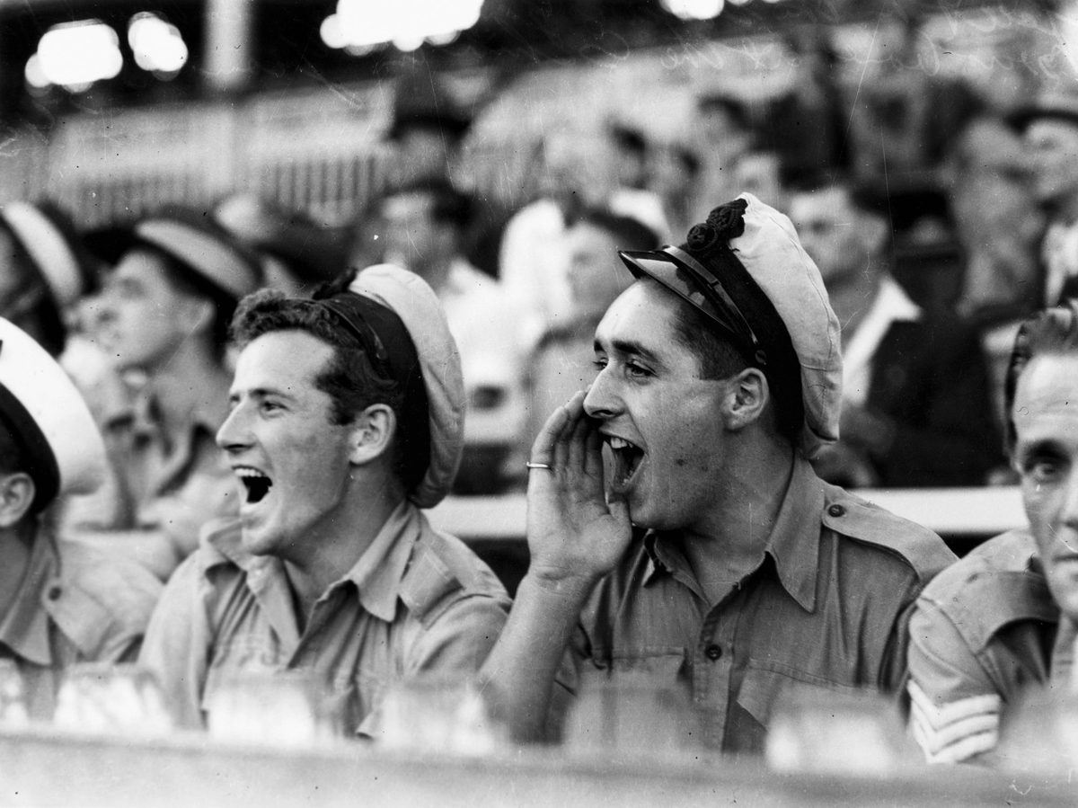 Navy men cheering for their soccer team, Brisbane, March 1945