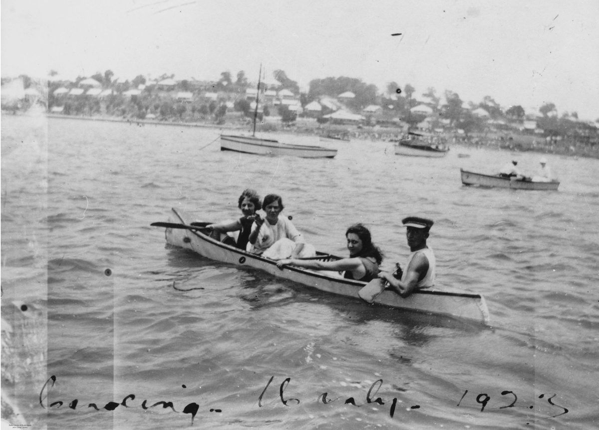 Group of four canoeing on Moreton Bay just off the Manly foreshore, Brisbane, 1923