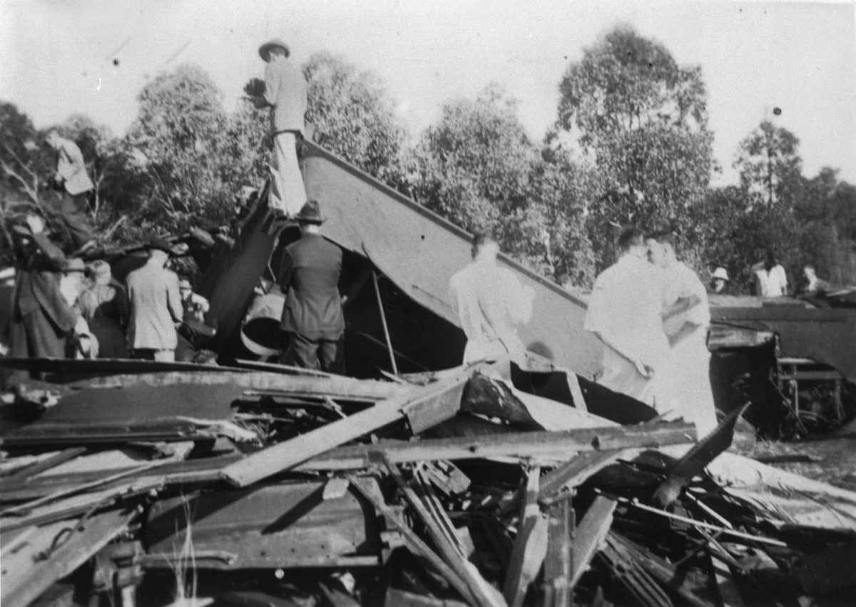 People gathered at the site of the Camp Mountain railway disaster, 1947