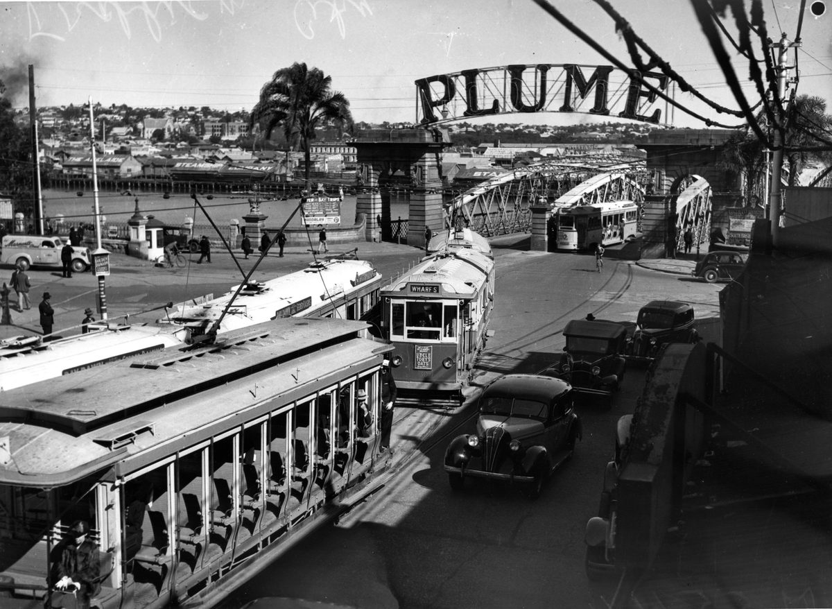 Electric trams travelling along Queen Street from the Victoria Bridge, Brisbane, 1939, Brisbane City