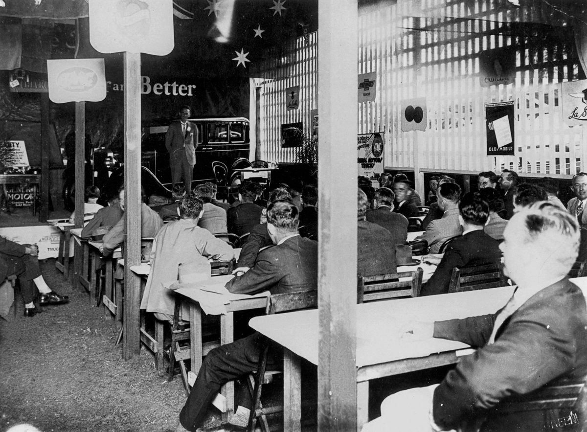 Delegates at the 1928 Dealers Convention looking at a new Oldsmobile, Brisbane