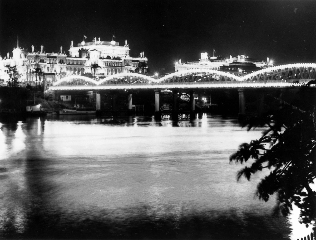 Victoria Bridge and Brisbane CBD buildings lit up for the Royal Visit in 1954, Brisbane City
