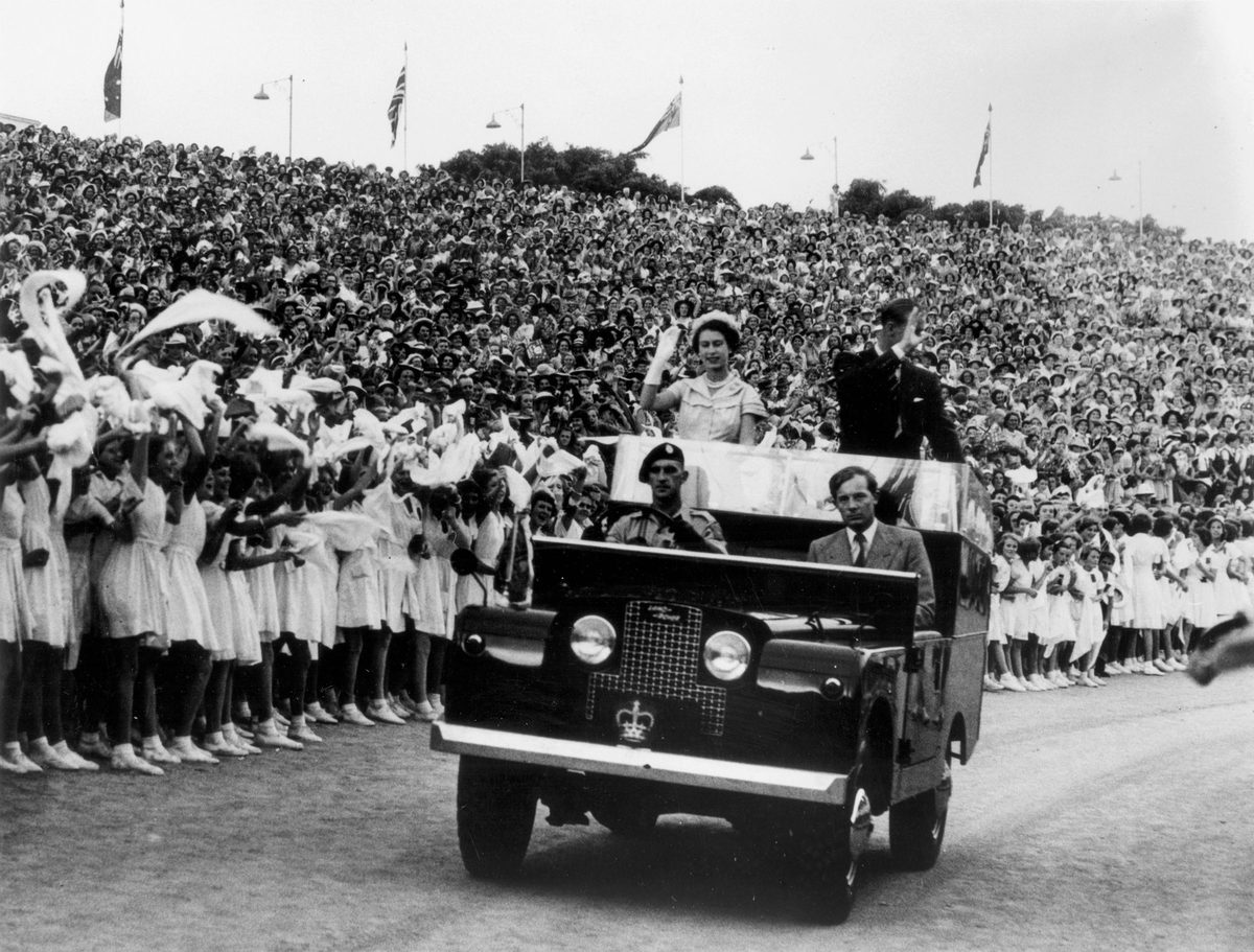 Crowds of schoolchildren greet The Queen and Prince Philip at Brisbane's Exhibition Grounds, 1954, Bowen Hills