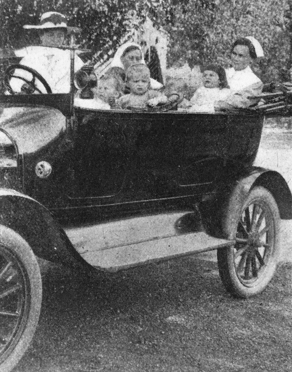 Motor vehicle with small children and nurses as passengers, Brisbane, 1917