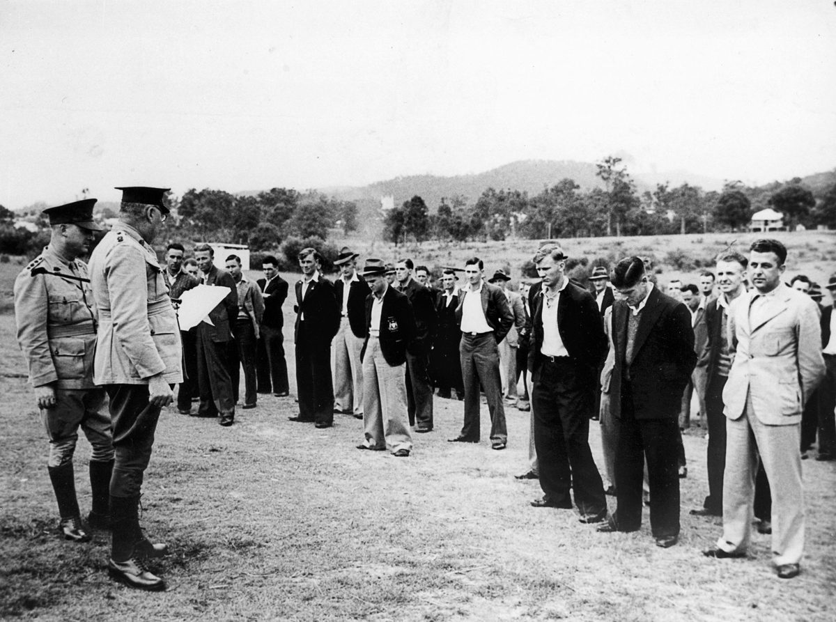 Lieutenant-Colonel Radford, Commanding Officer of the reception depot, Frazers Paddock, selecting men for units in the 7th Division, Brisbane, 1940