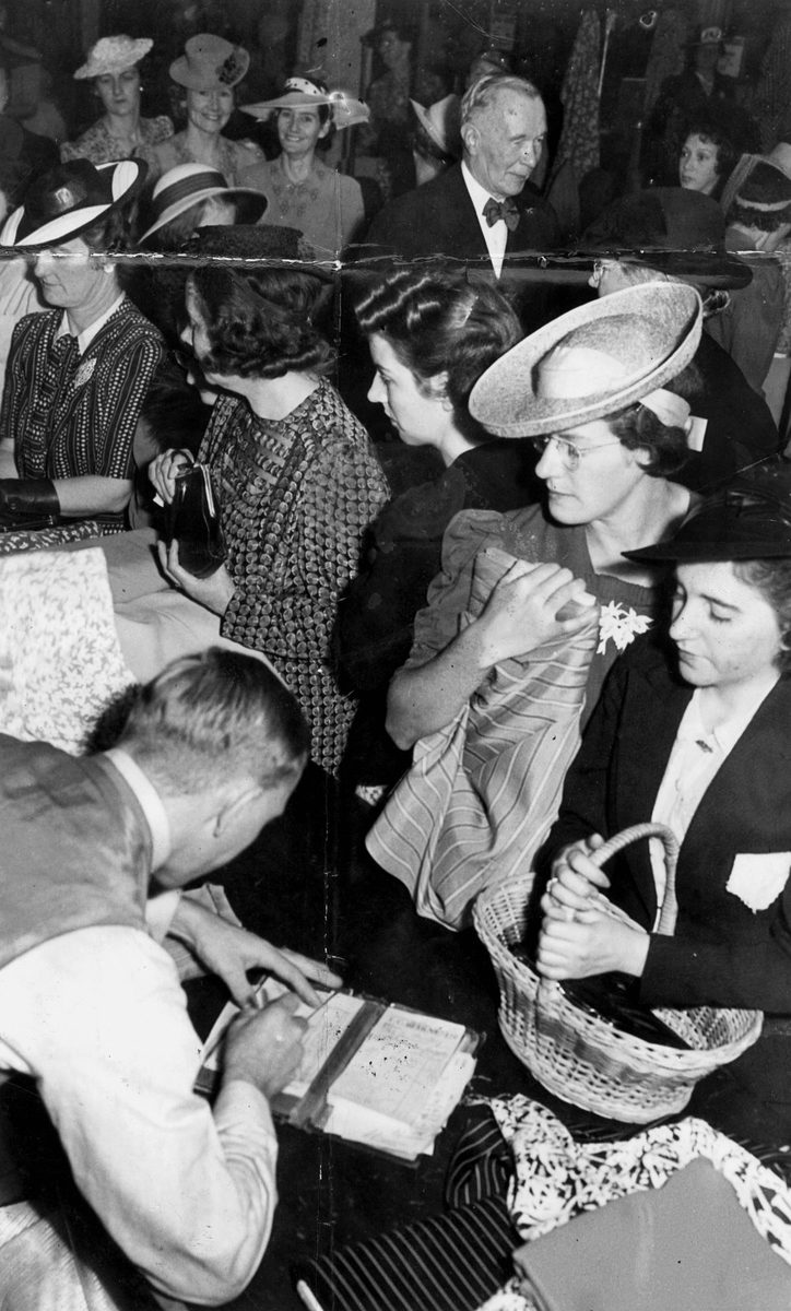 Shoppers purchasing rationed goods in T.C. Beirne's store in Brisbane during World War II (1942)