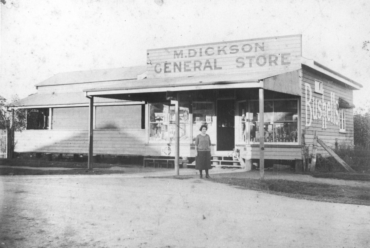 Miss Dickson standing in front of the Dickson General store, Geebung (1922)