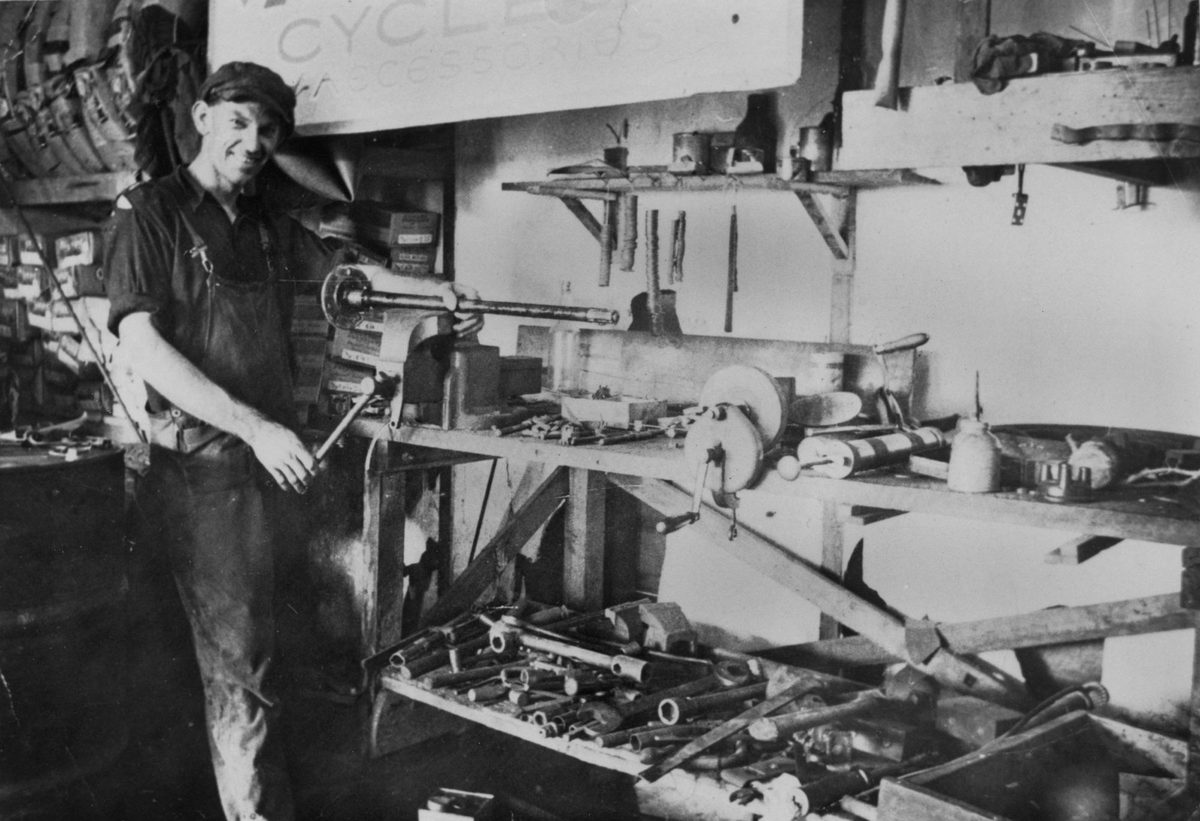Mechanic at the tool bench in the Woody Point Garage, 1936