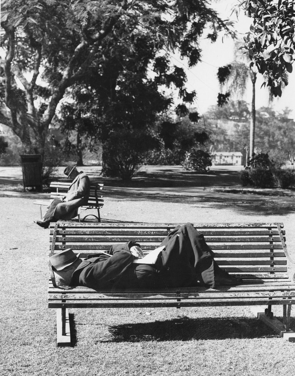 Men sleeping on park benches in the City Botanic Gardens, Brisbane, 1949