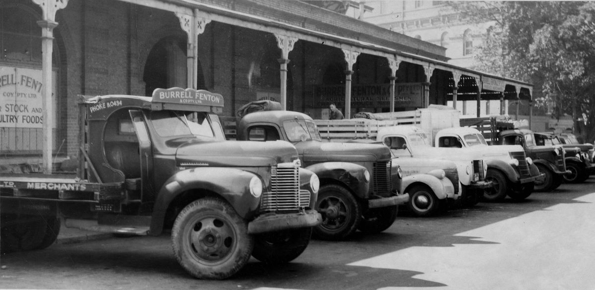 Motor vehicles unloading produce at the markets in Roma Street, Brisbane, 1951, Brisbane City
