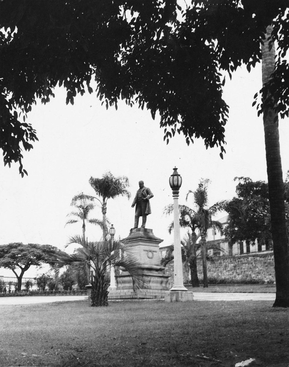 Statue of Robert Burns that stands and surveys the splendid gardens at Centenary Place, Brisbane, 1949