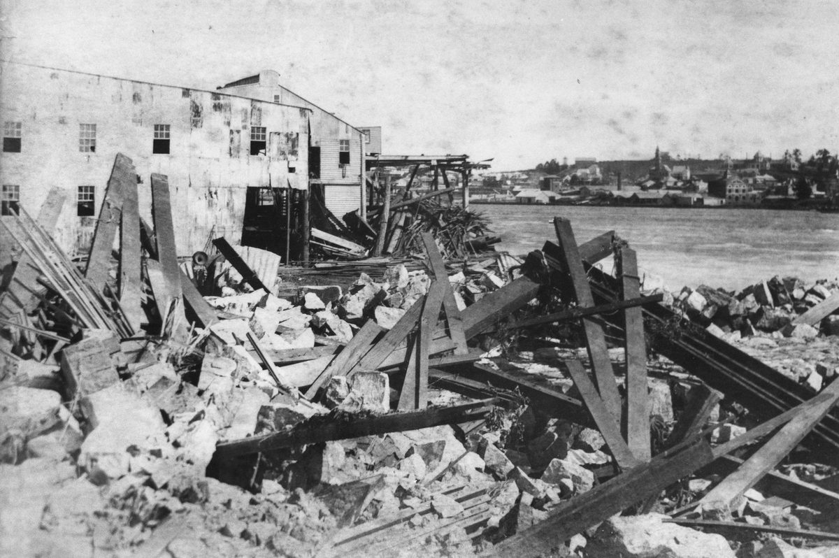 Debris around Pettigrew's Mill yard, William Street, Brisbane, in the wake of the 1893 flood, Brisbane City