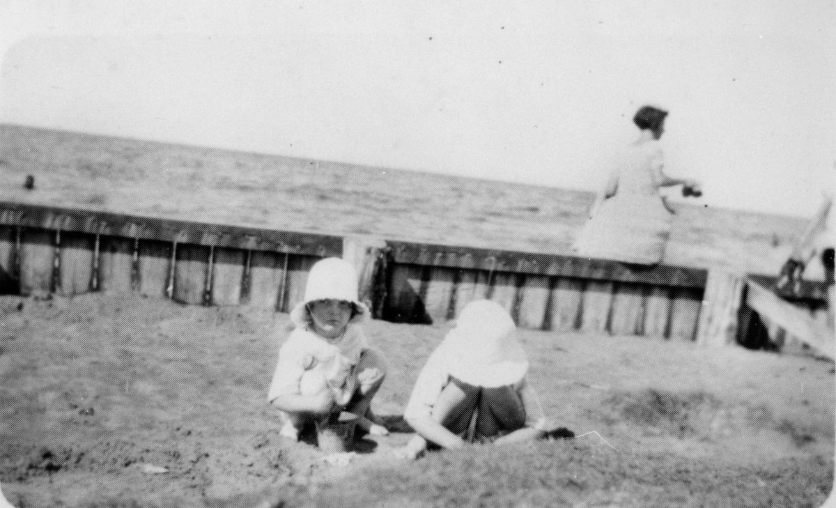 Small children playing on the beach at Cribb Island, 1928