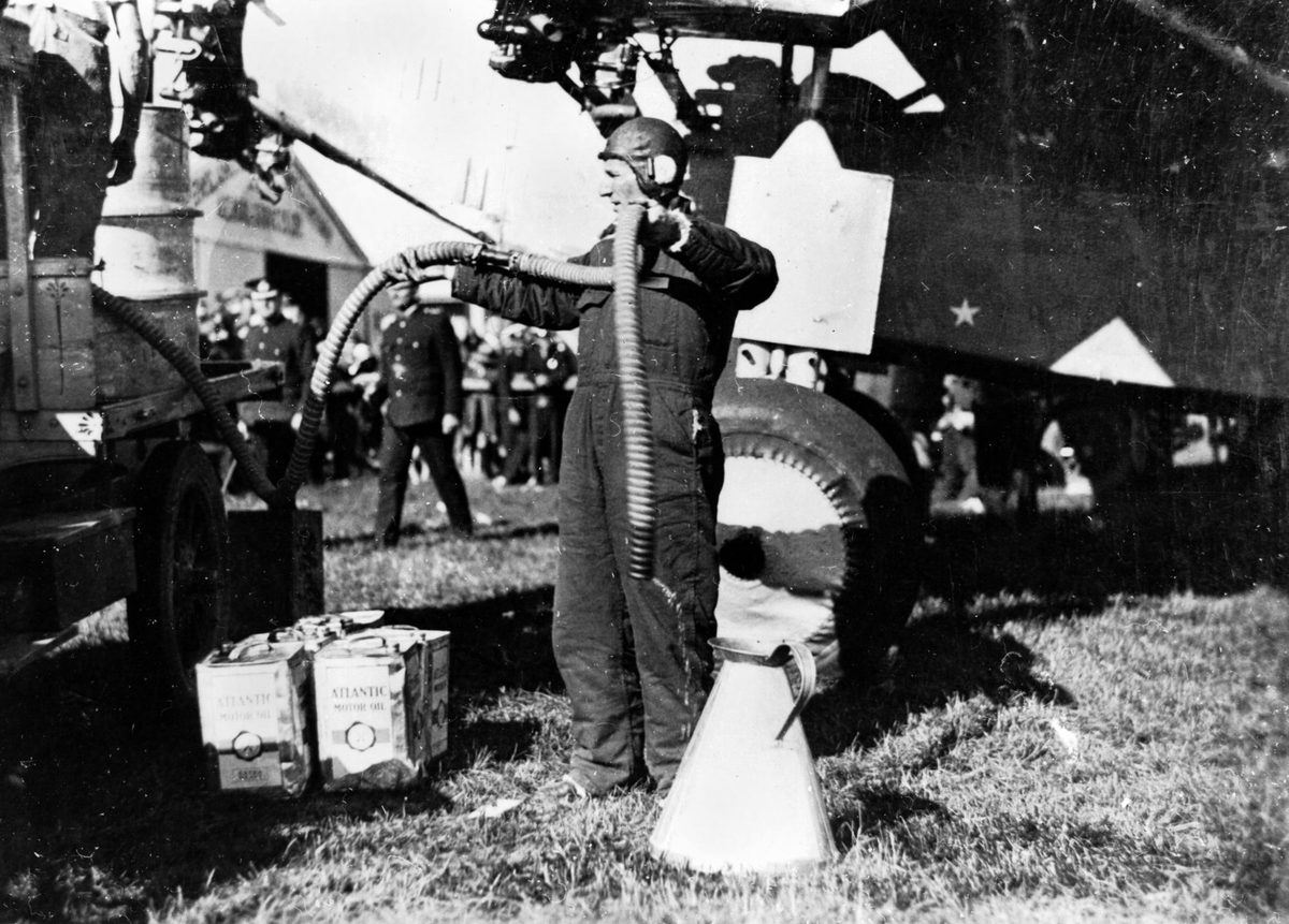 Charles Kingsford Smith refuelling his plane in Brisbane, June 1928, Archerfield